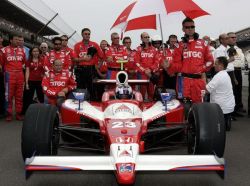 Milka in her race car with her team and on the grid just before the start of her historic Indy 500